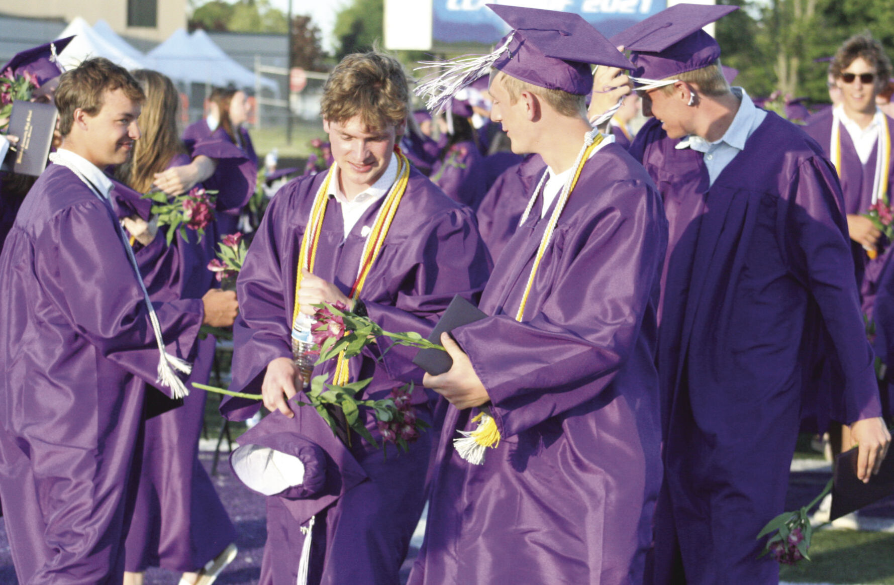 Diplomas in hand